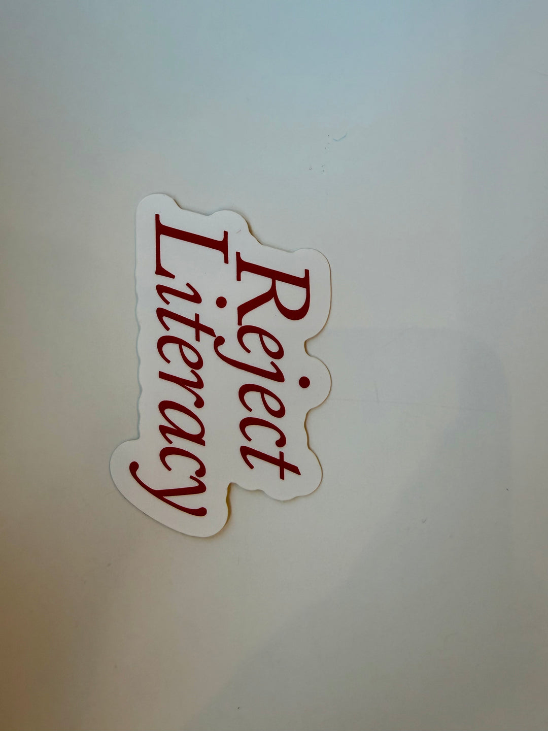 REJECT LITERACY Sticker